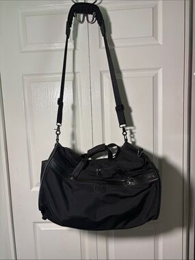 Hartmann zip around nylon and leather duffle style bag.